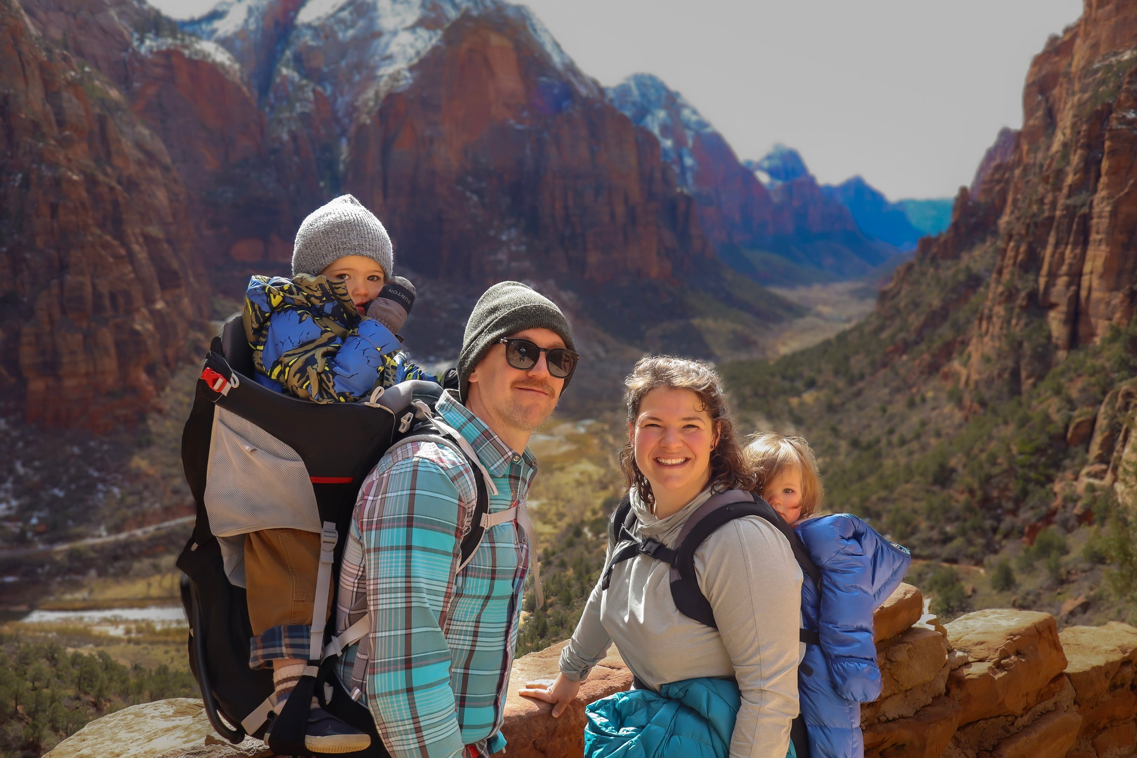 Olivia Poyer and her family at a summit in Zion National Park — representing intentional living, motherhood, and outdoor adventure.