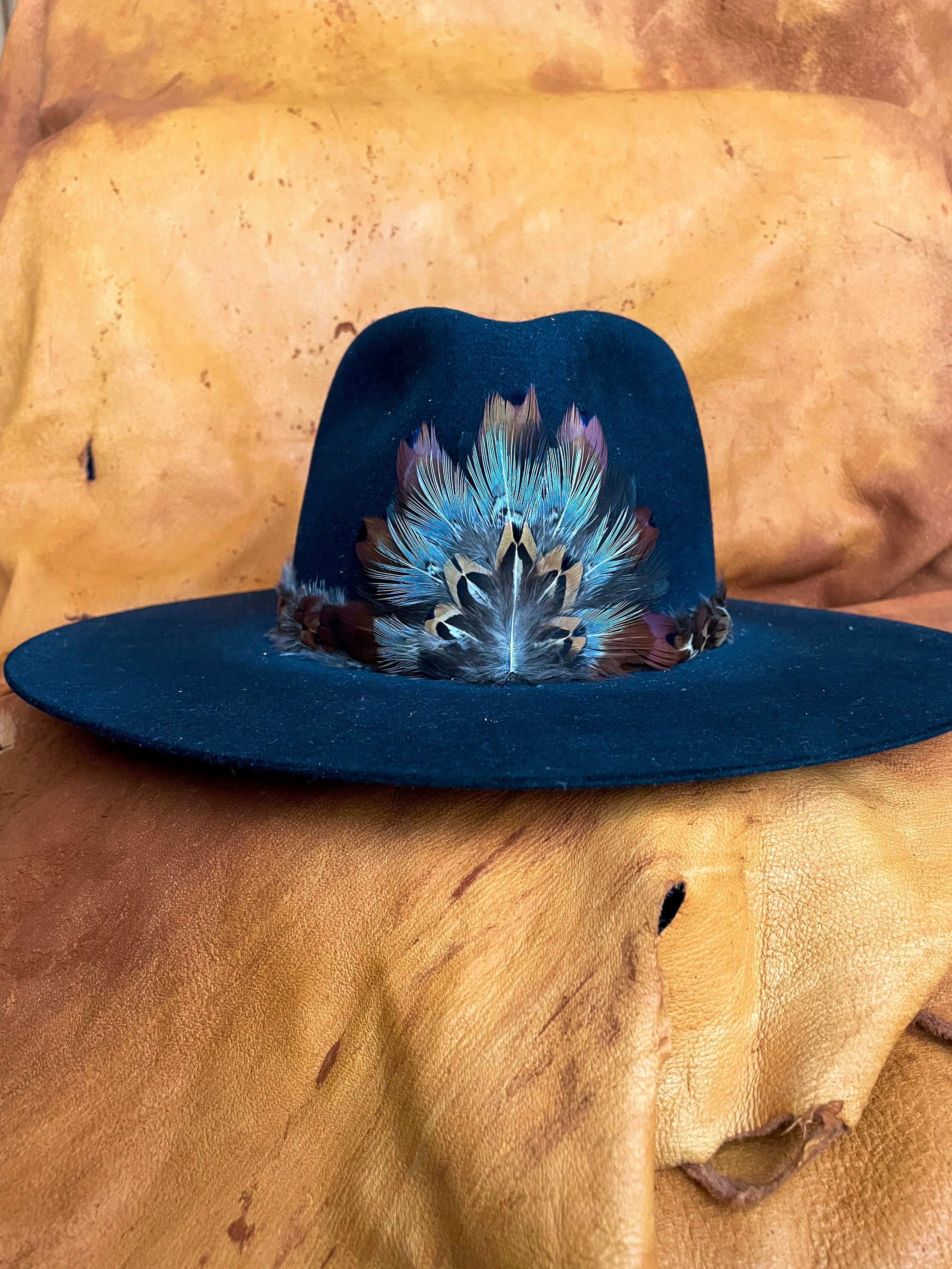 Handmade feather medallion and hatband with rust, blue, white and golden pheasant feathers