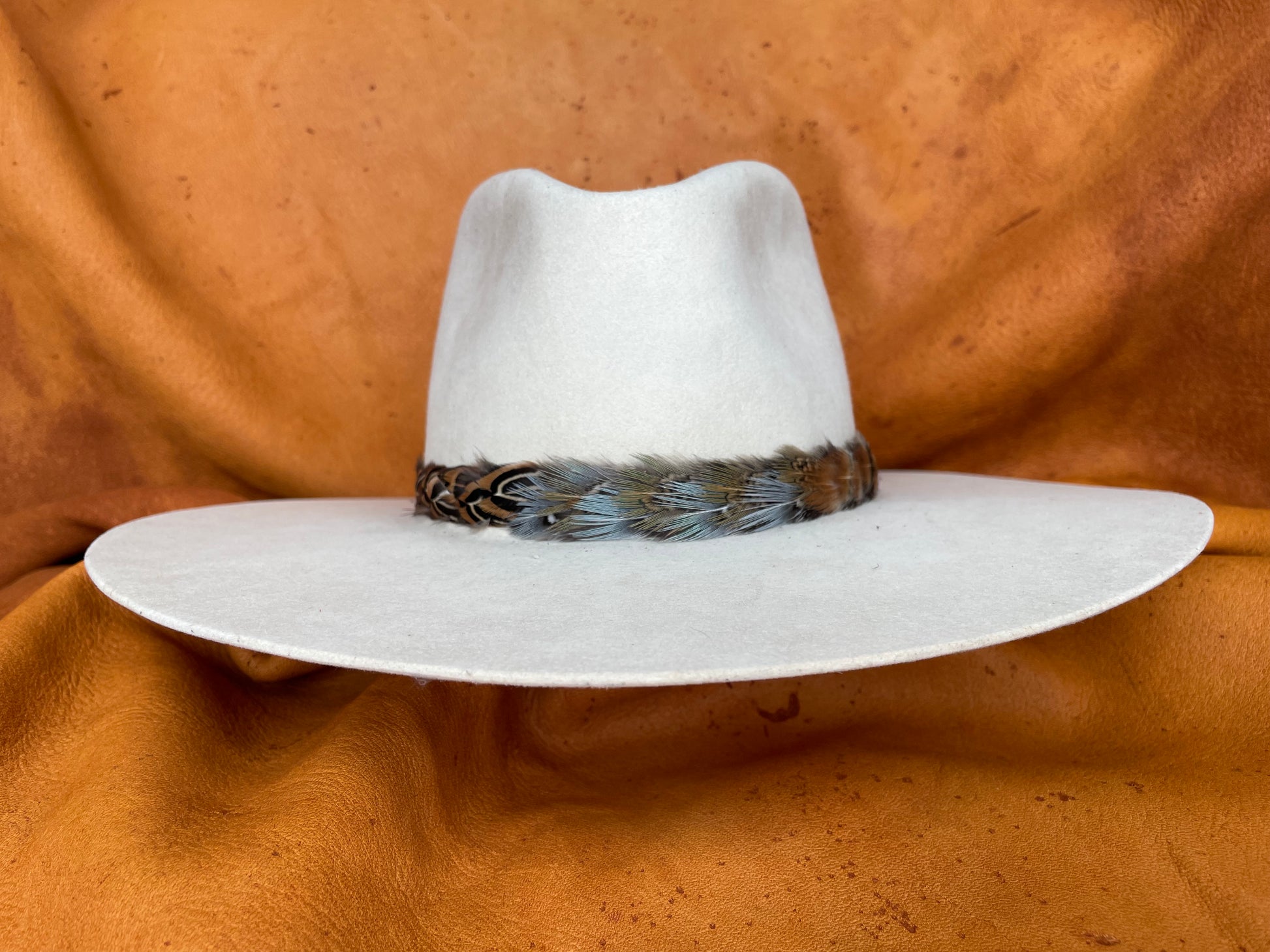 Briar multicolor pheasant feather hatband on cream hat