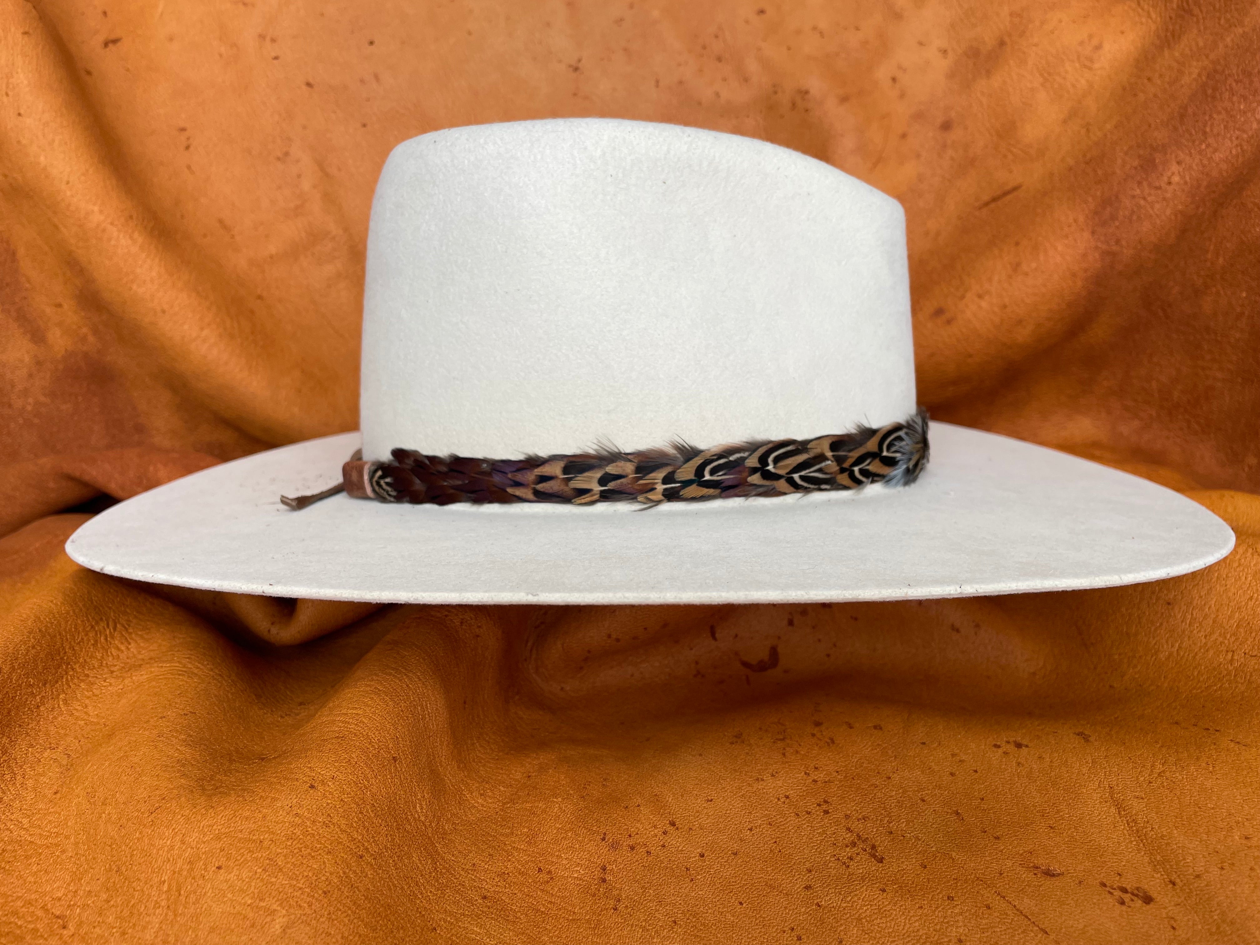 Green, gold, and maroon feather hatband side view