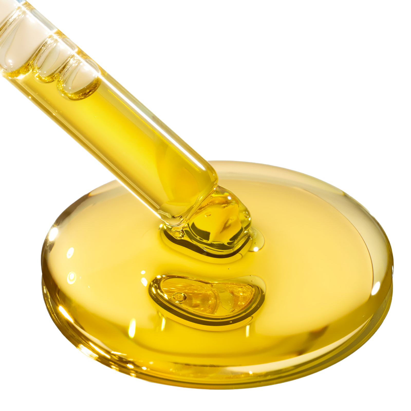 A dropper hovering above a puddle of Crunchi I AM Luminous oil as if freshly dispensed on a clean backdrop.