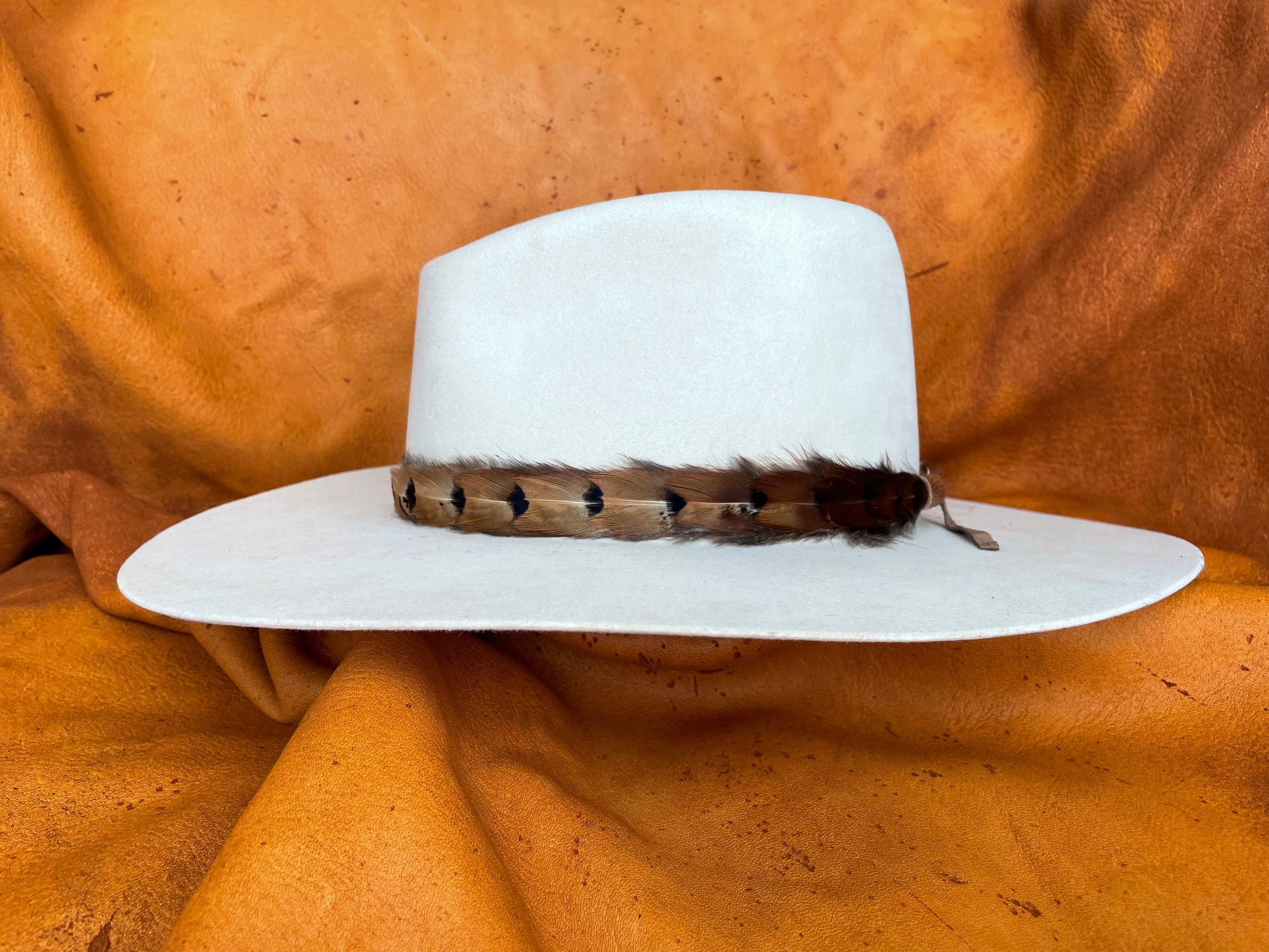 Artisan feather hatband with leather ties