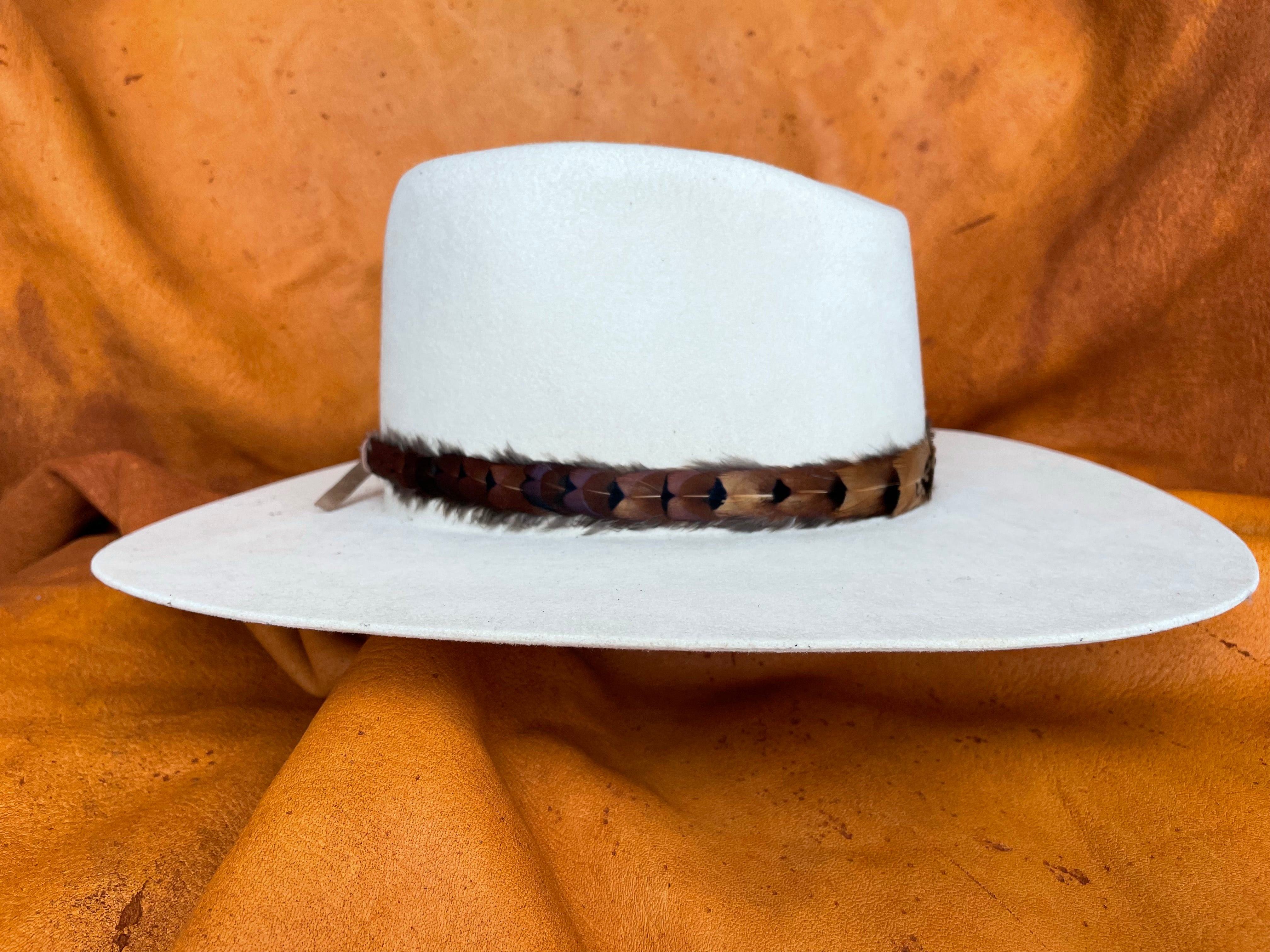 Golden rooster pheasant feather hatband on cream hat
