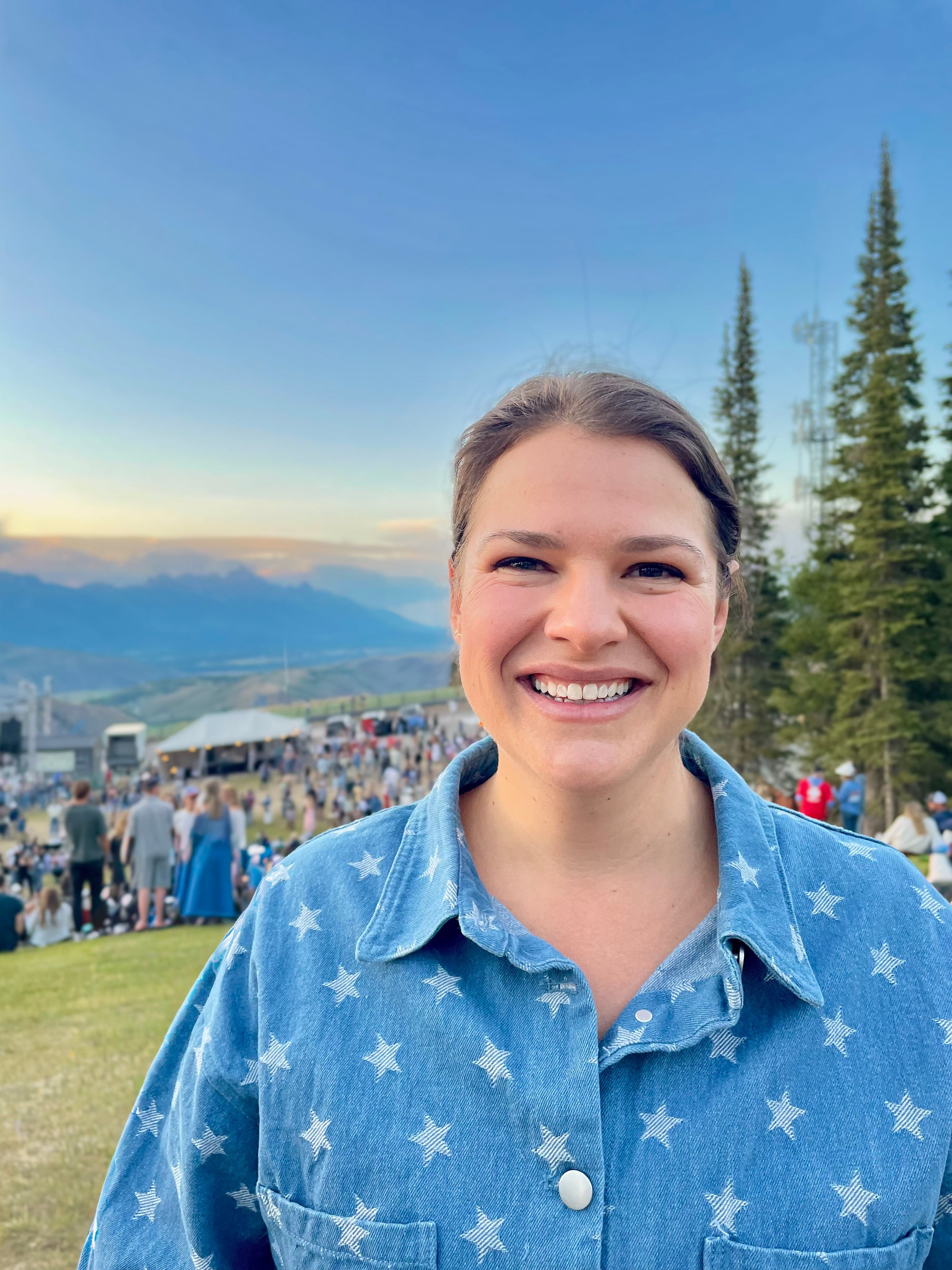 Portrait of Olivia smiling with the Tetons in the background — natural beauty and grounded confidence.