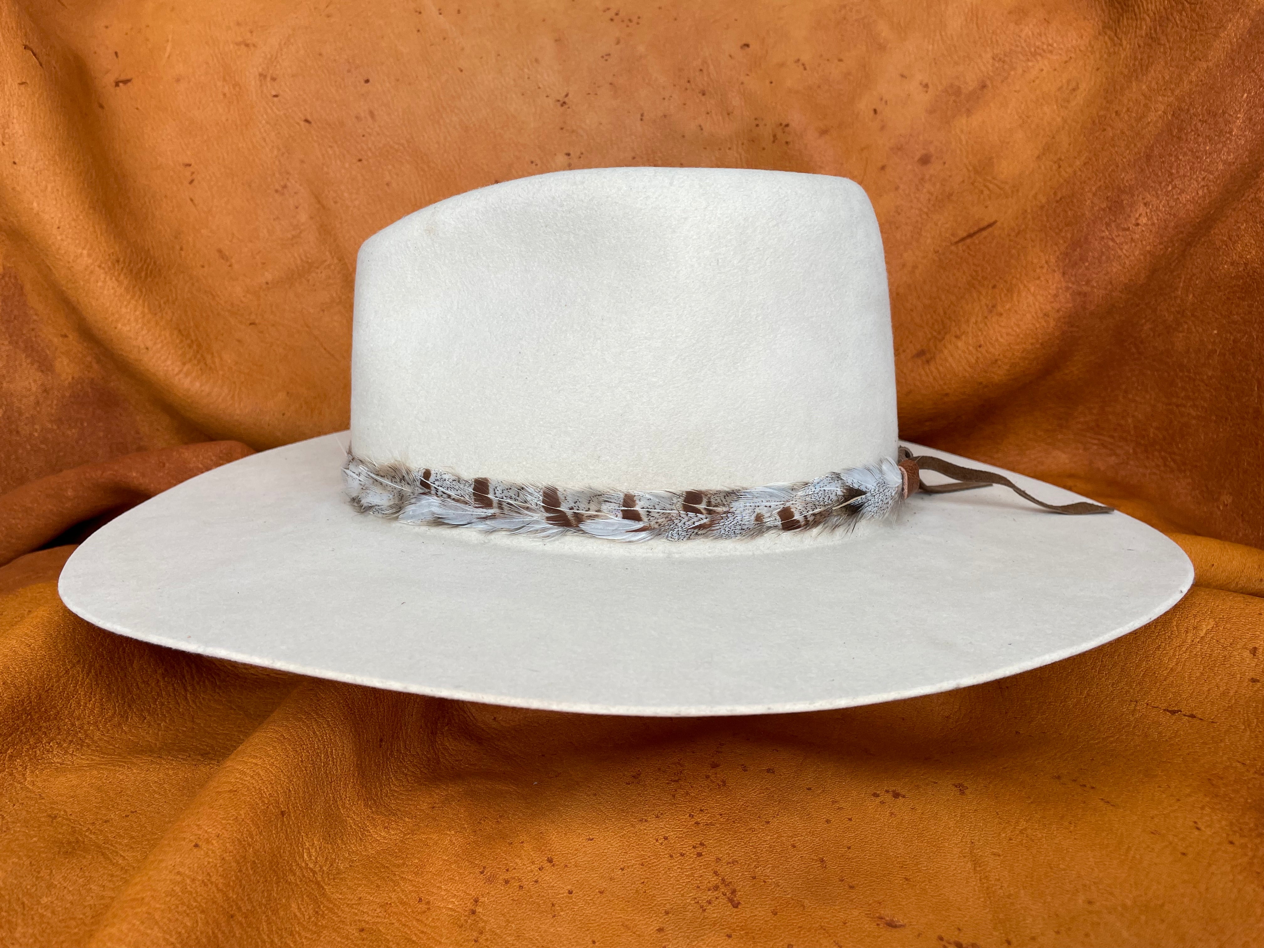 Ophelia feather hatband in white, grey, and rust tones, side angle.