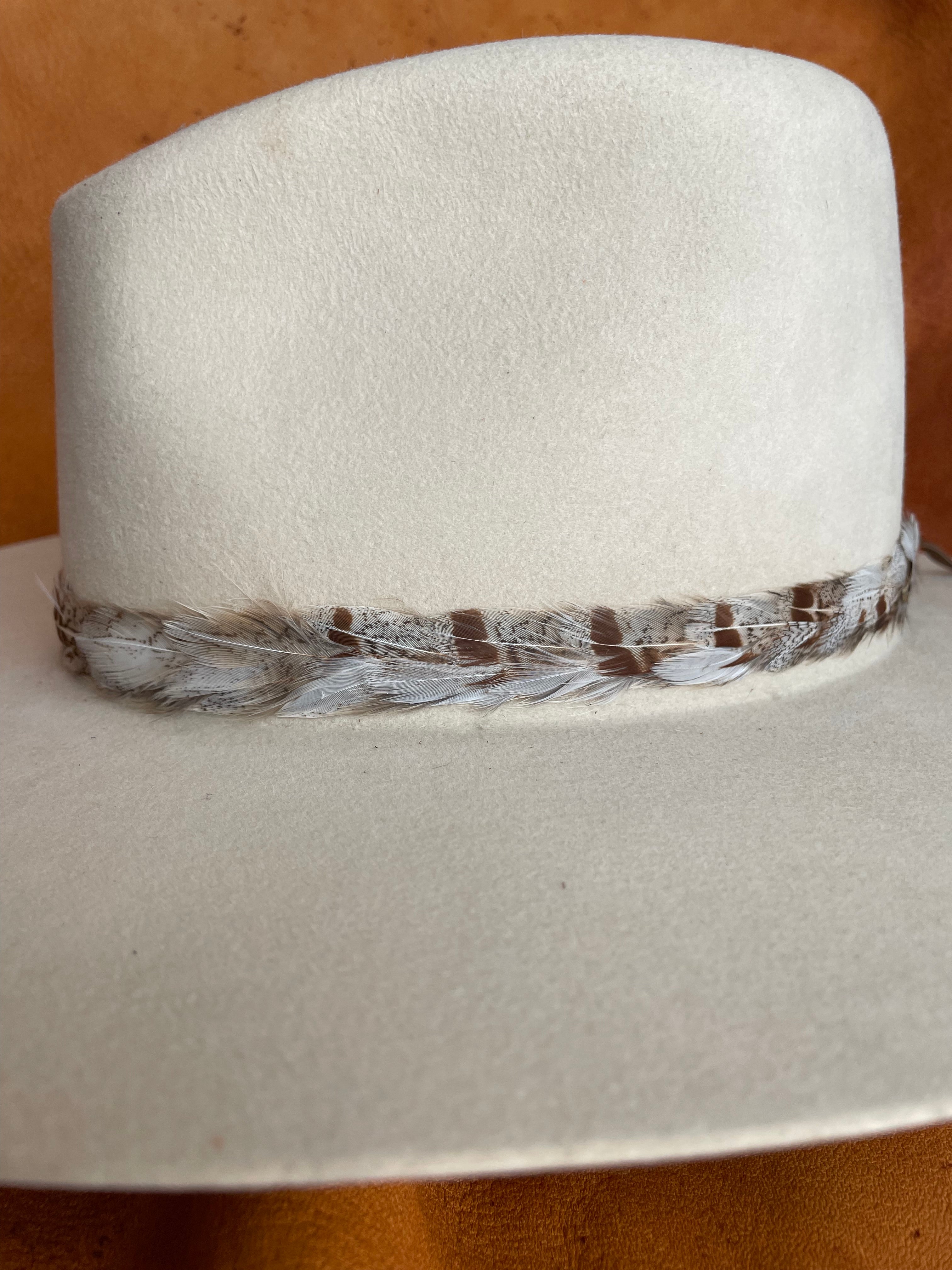 Ophelia feather hatband close-up showing natural white and rust pattern