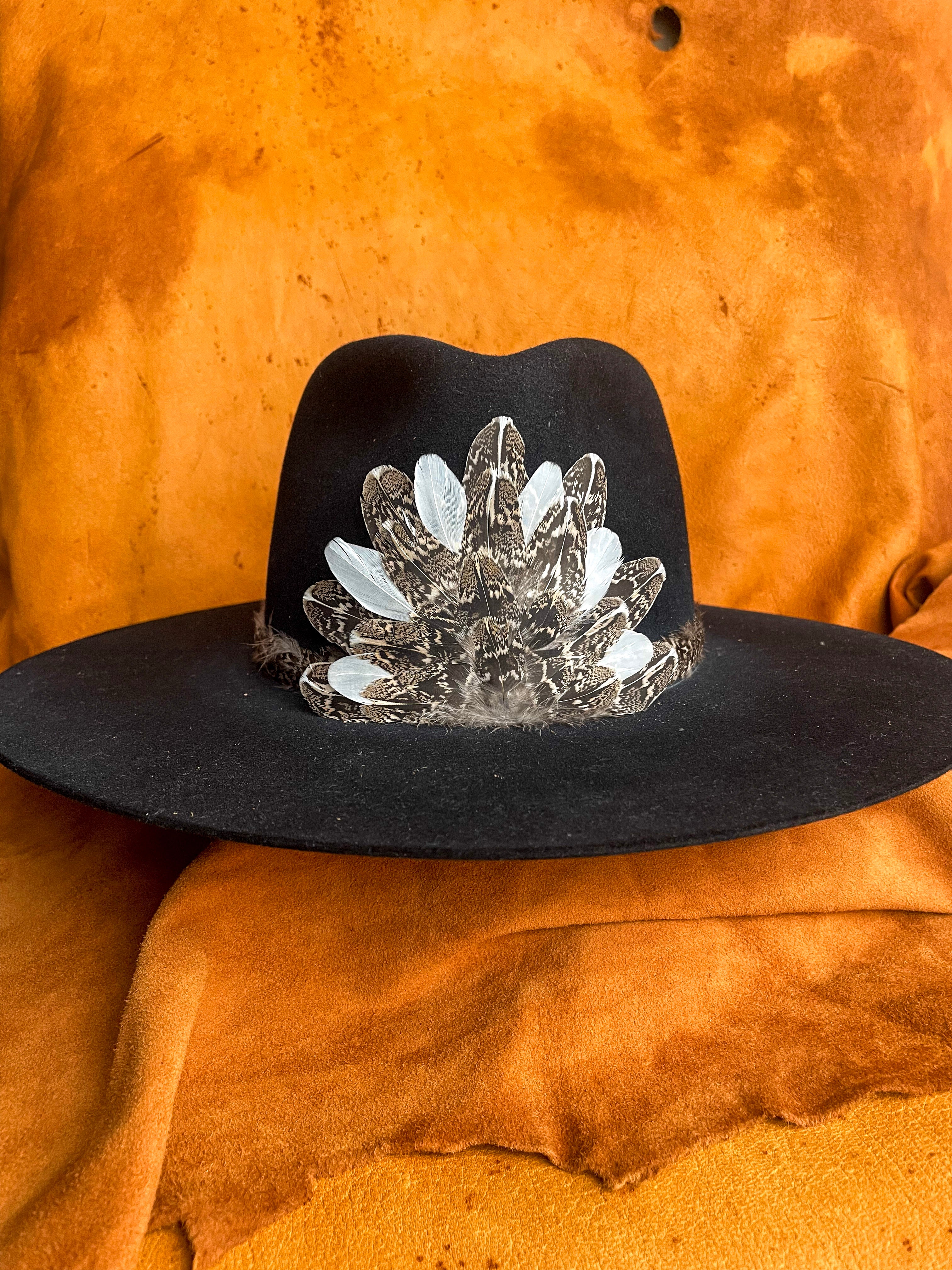 Removable magnetic medallion with soft feather layering and pops of white for contrast. 