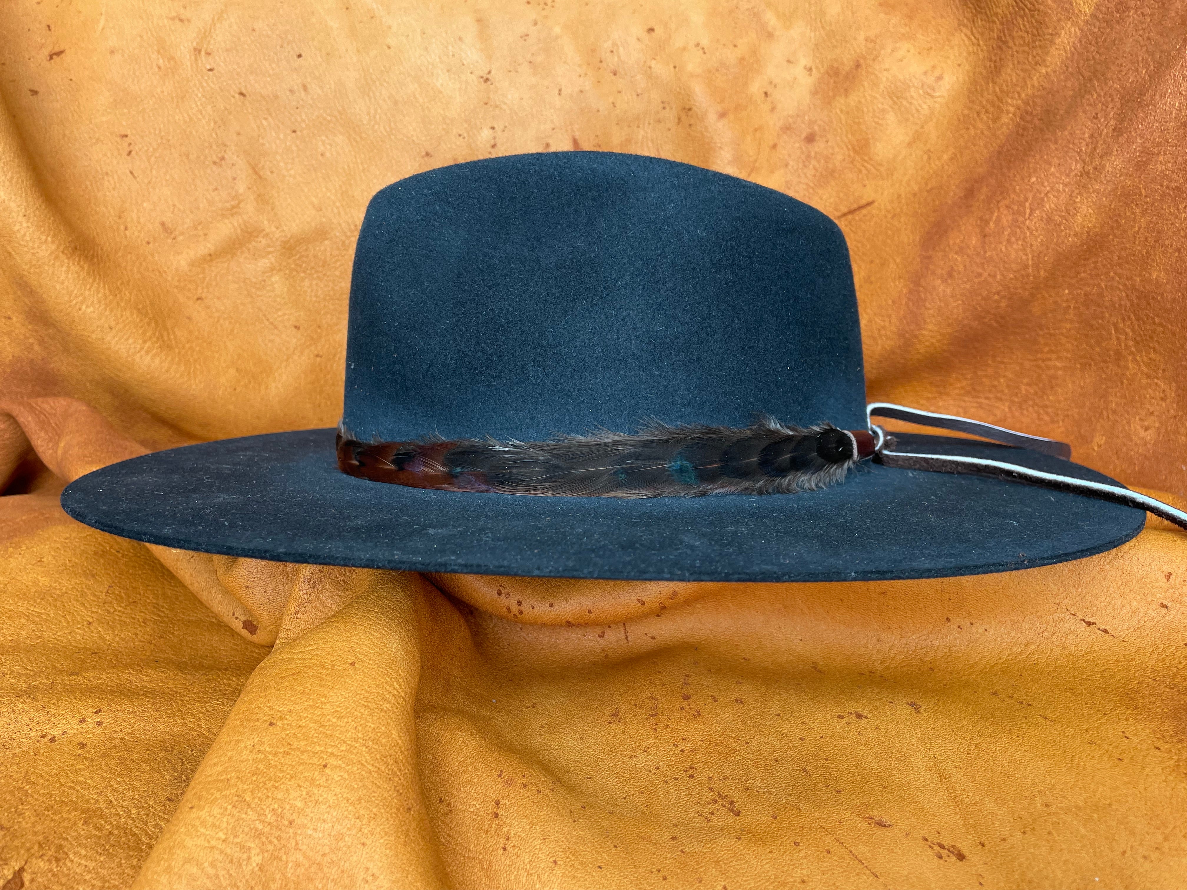 Rowan black feather hatband with green sheen on black hat