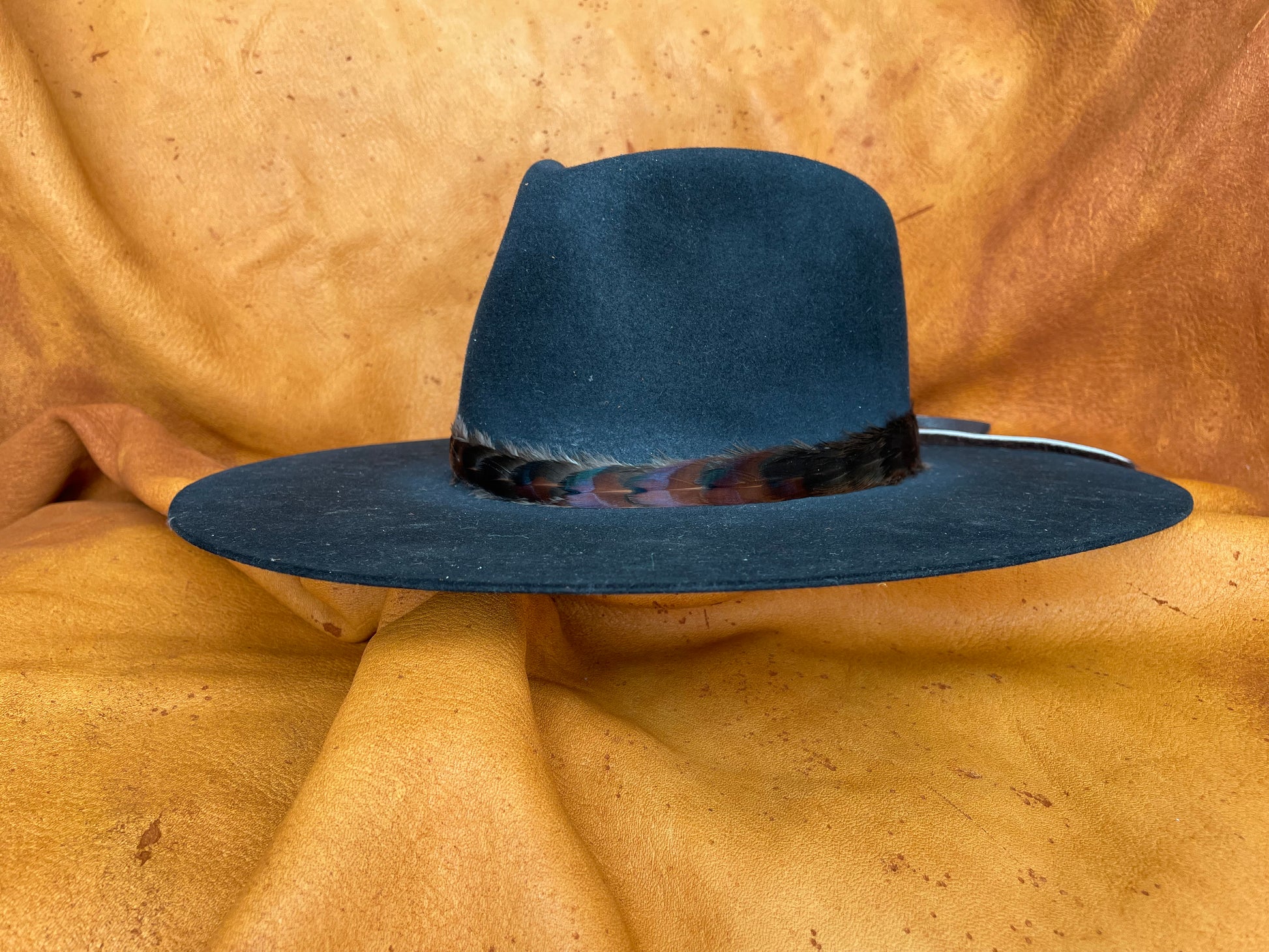 Subtle maroon & black feather hatband, angled view