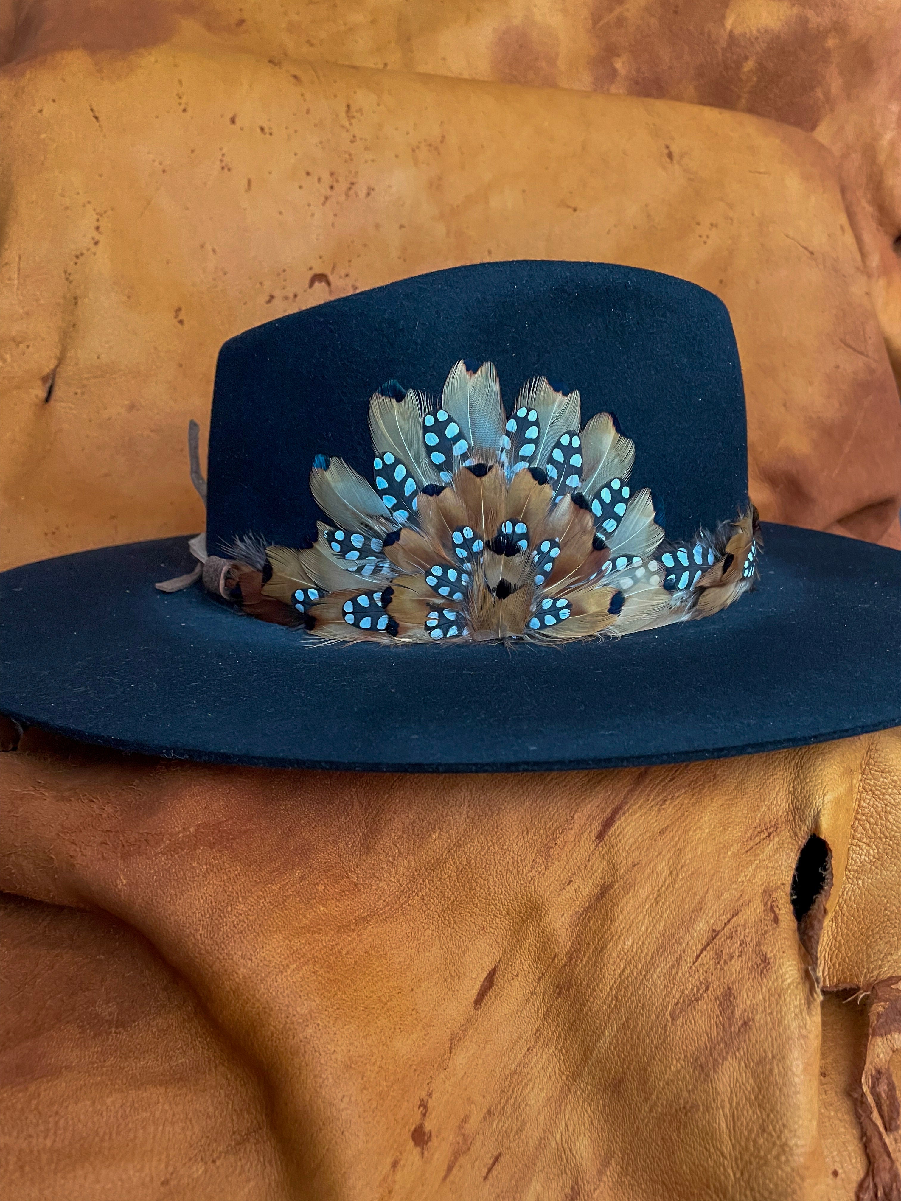 Handmade feather hatband and adjustable magnetic medallion with golden pheasant feathers and black polka dot quail feather accents.