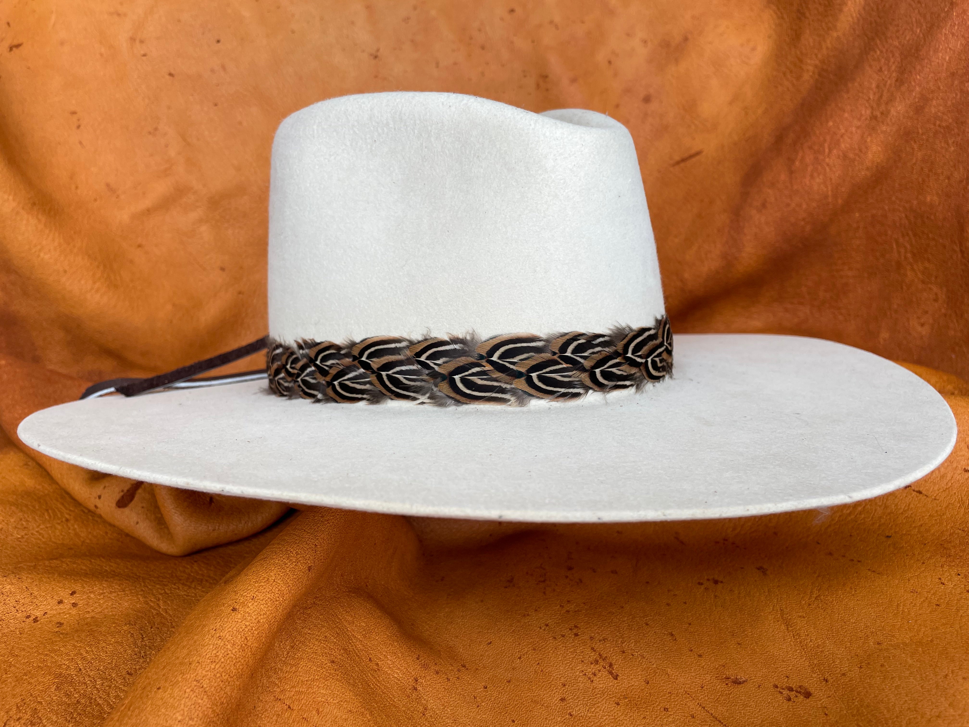 Sutton golden pheasant feather hatband on cream hat, front view